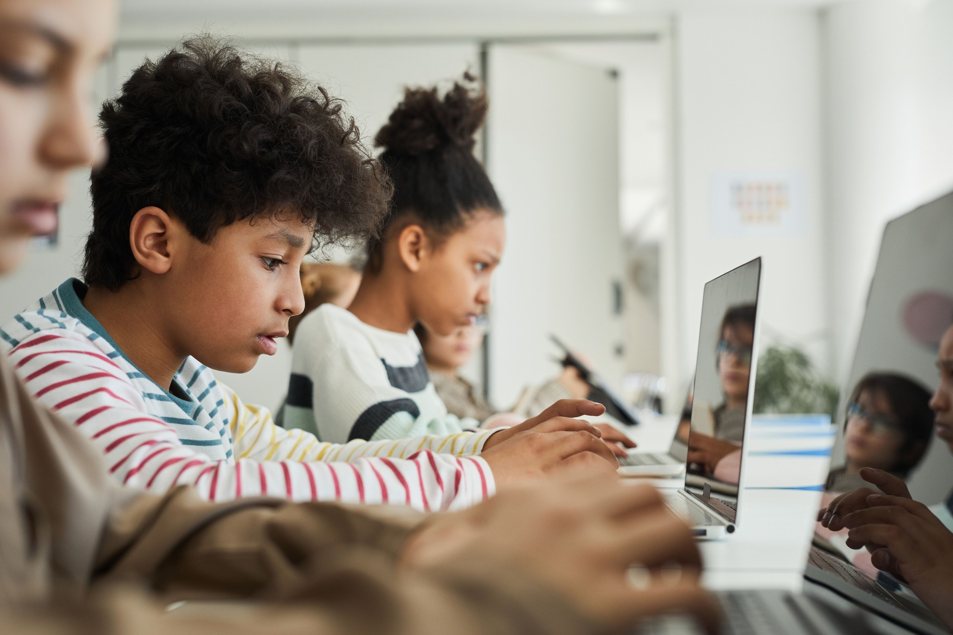 Group of Kids Studying IT in Class