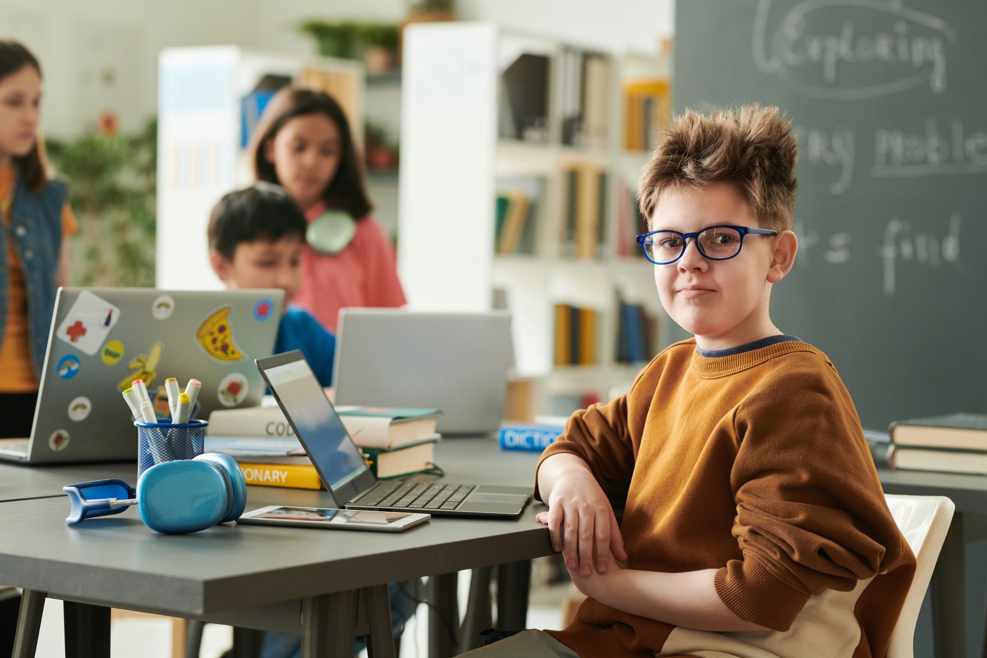 Boy Looking at Camera in Computer Class